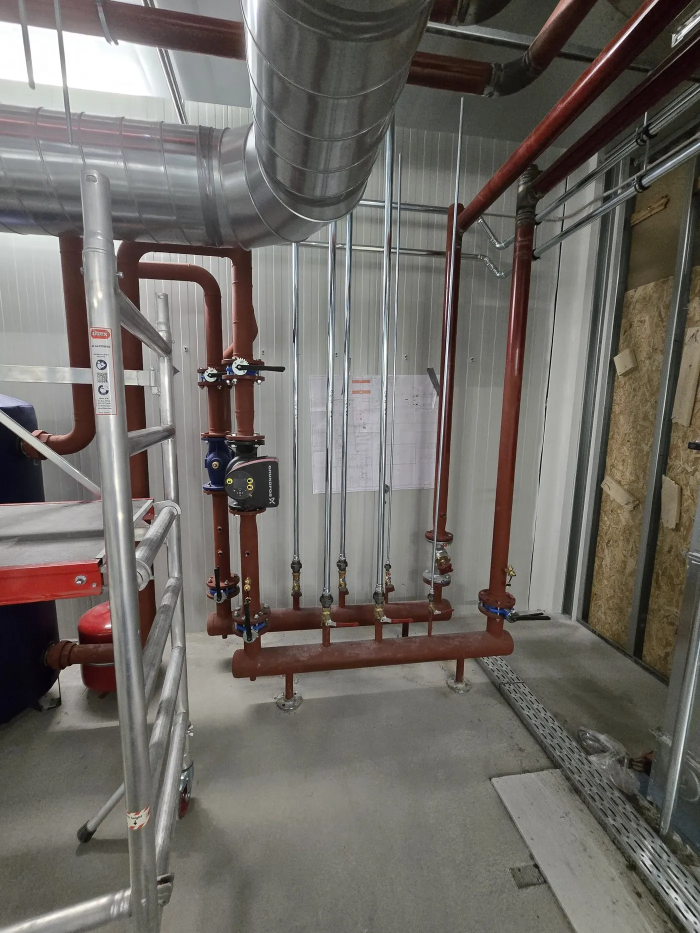 Pipework along the ceiling, installed from a ladder