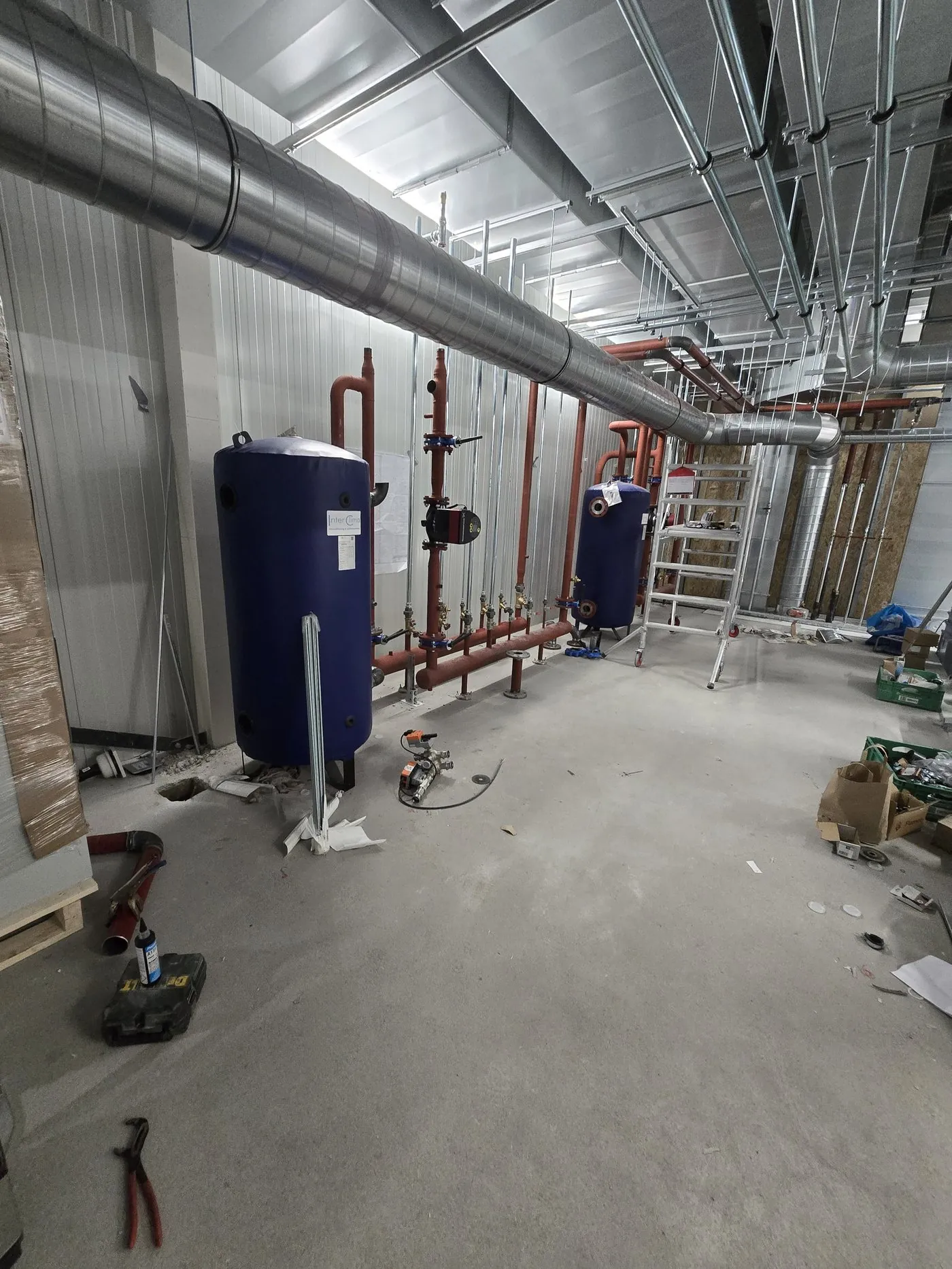 Plant room with boiler vessels and pipework