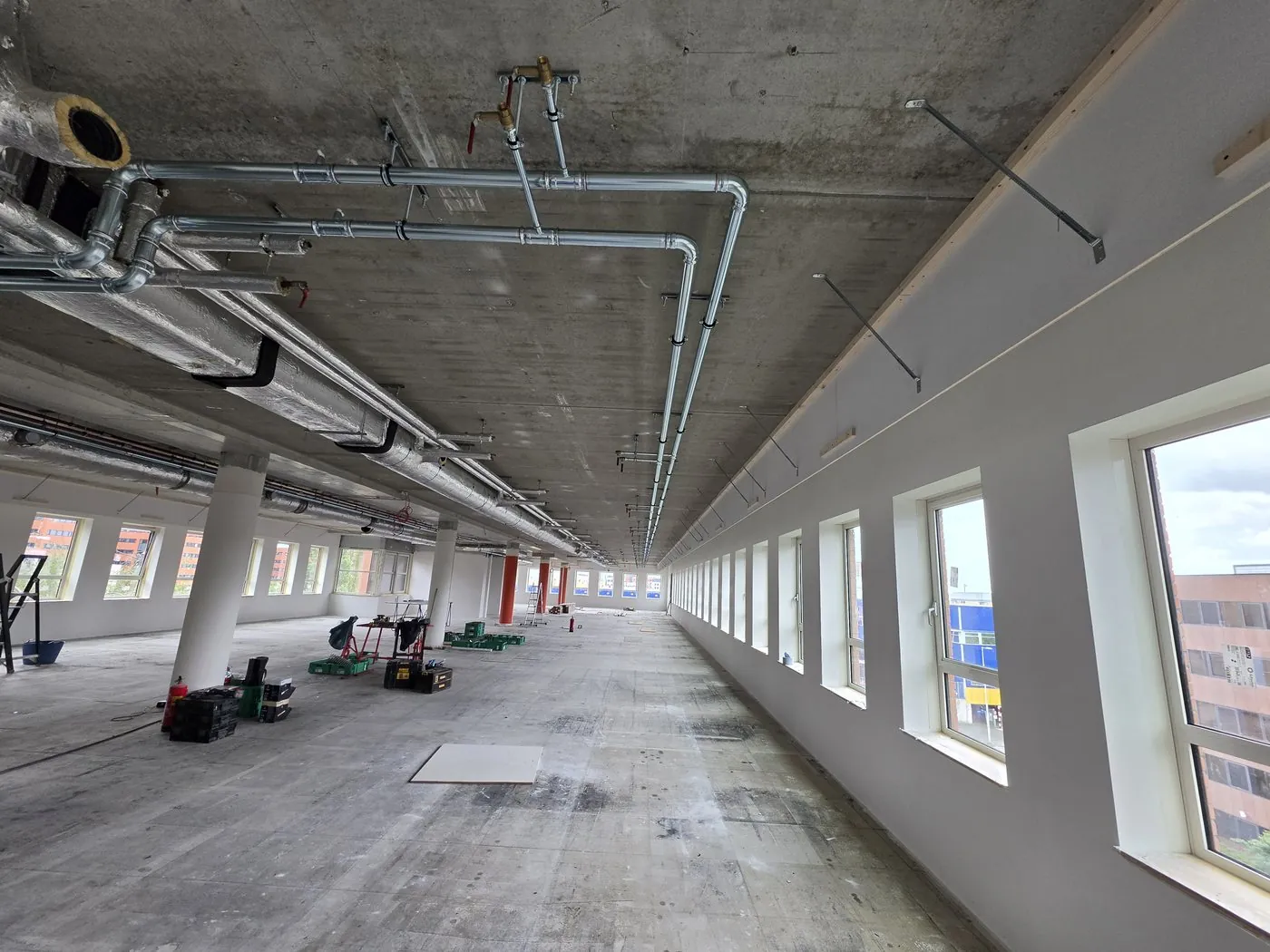Pipework on the ceiling of a long office floor