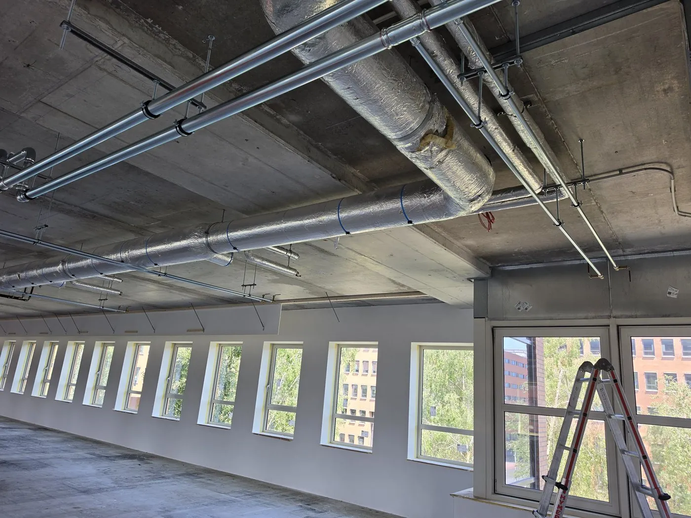 Pipework and cabling on the concrete ceiling