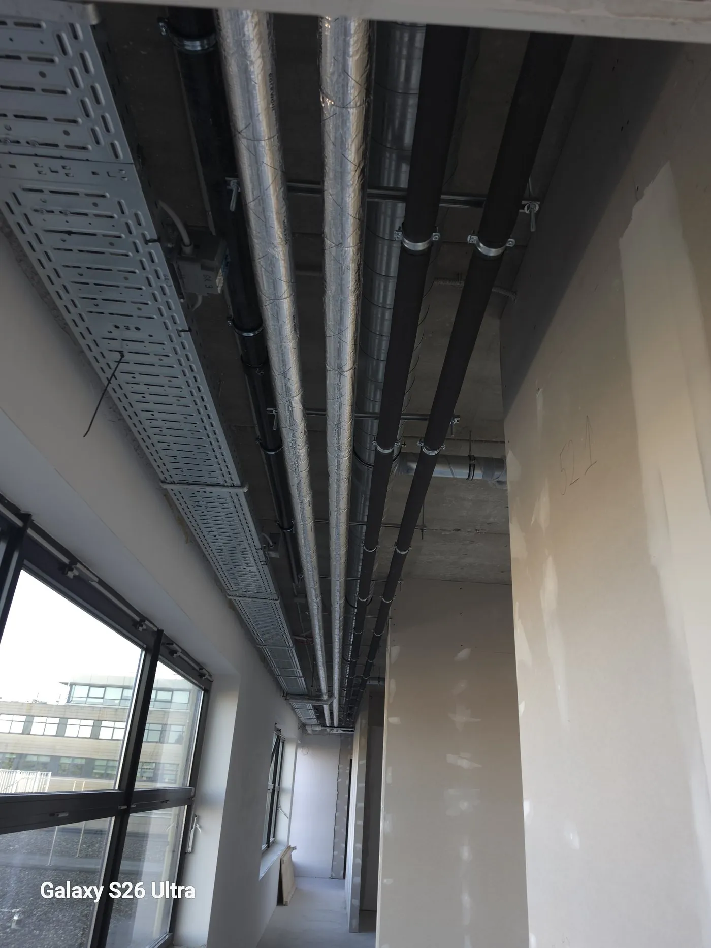 Cable tray on the ceiling, with a view outside