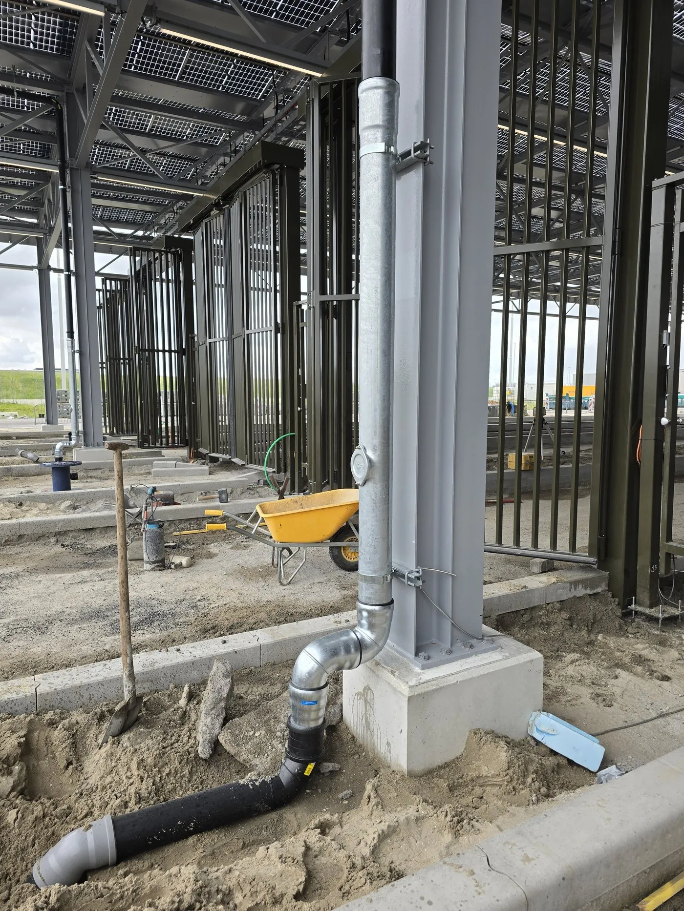 Pipe connected to a concrete foundation under the solar roof