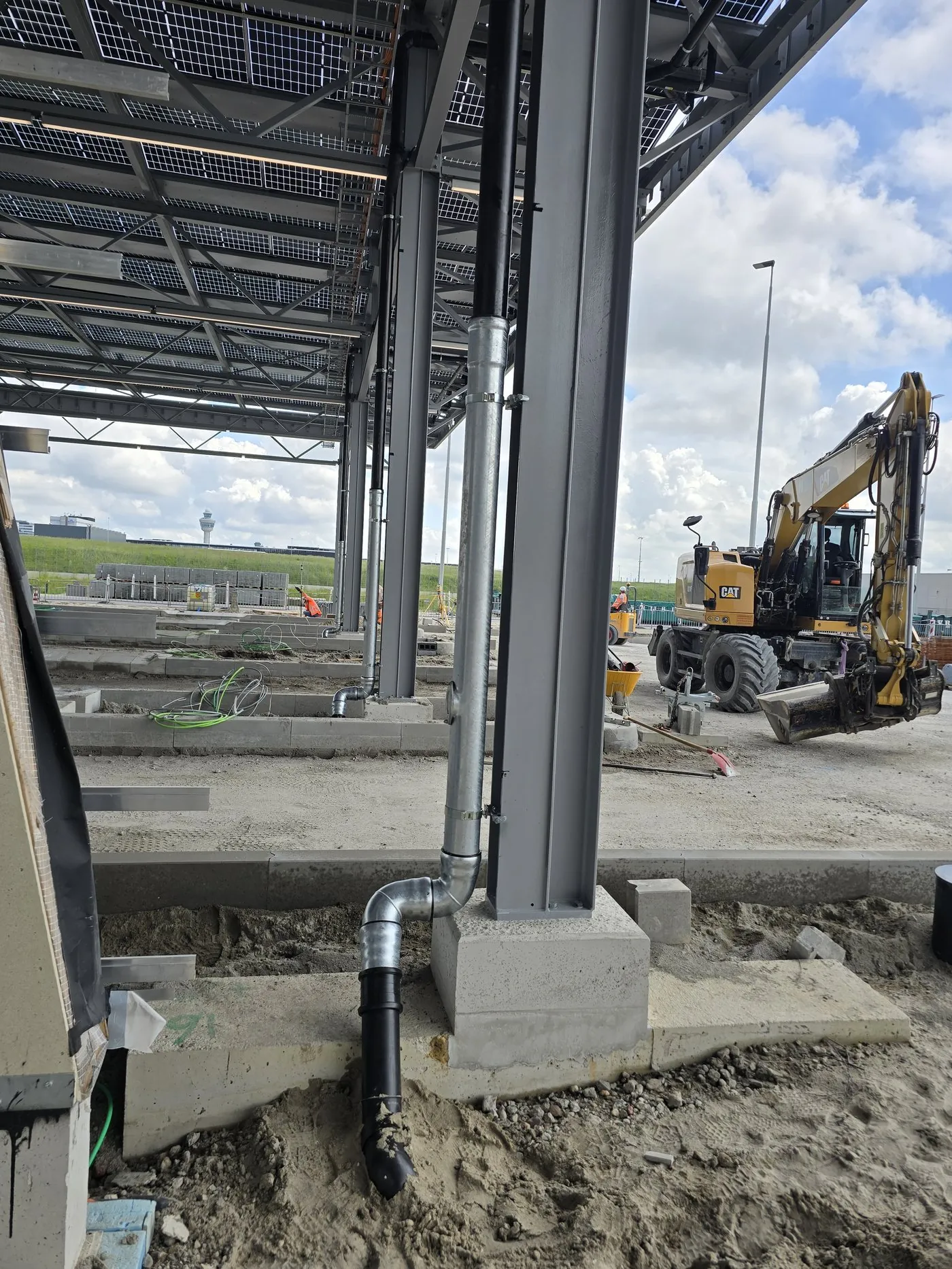 Pipe connection to a concrete foundation under the solar roof